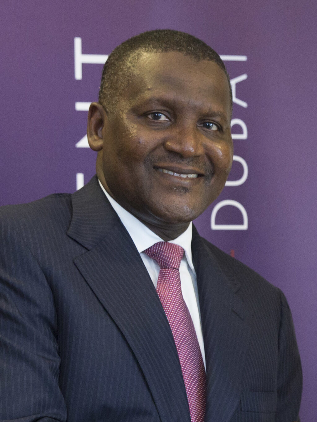 Al_Shabani_at_the_acquisition_of_Dangote_Cement_by_ICD_in_2014_(cropped)