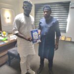 Momentous Magazine Publisher Amb. Prince Sesan Rufus Awobiye Presents MOPA Award Notification Letter to Adeboro Adamson, SAN in Abuja