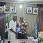 Momentous Magazine Publisher Amb. Prince Sesan Rufus Awobiye Presents MOPA Award Notification Letter to His Excellency Amb Dr. Duru Hezekiah Chinenye in Abuja